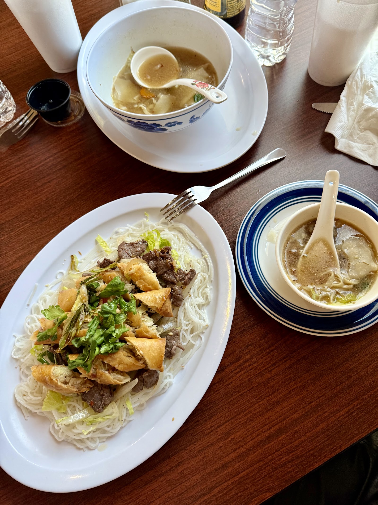 Beef vermicelli plate with egg roll and wonton soup